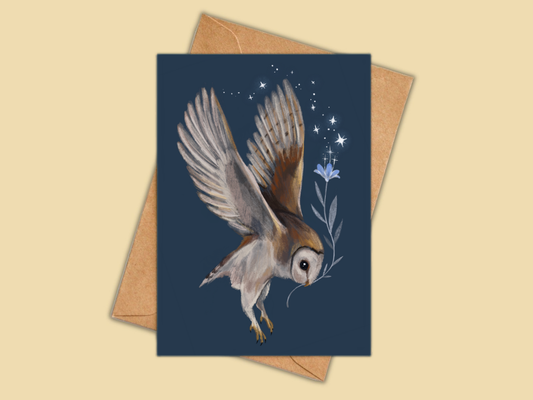 Barn Owl greeting card by Anna Seed: a barn owl in flight carrying a blue flower under the stars on navy