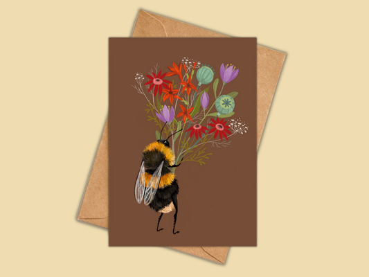 Bee with a Posy greeting card by Anna Seed: a bumblebee carrying a bunch of wildflowers on chocolate brown