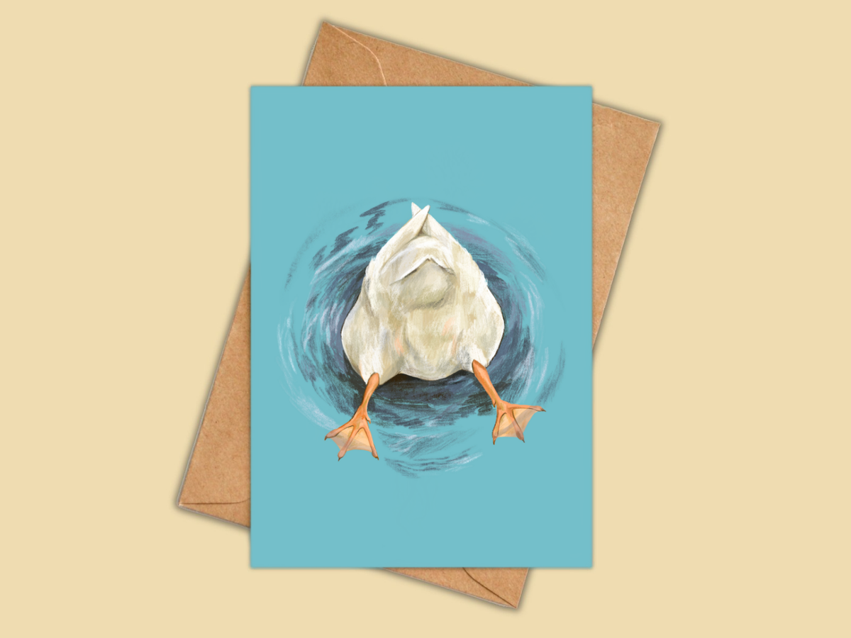 Butt Quack greeting card by Anna Seed: a white duck upside down with its bottom and orange feet in the air, on teal