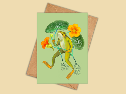 Happy Frog greeting card by Anna Seed: a joyful frog dancing with orange nasturtium flowers and leaves, on pale green