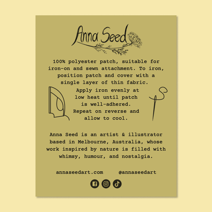 Reverse of the iron-on patch backing card with care and ironing instructions, an artist bio and social links