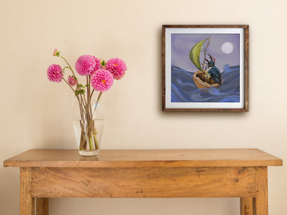 Admiral Stagg print of a beetle sailing stormy blue waves, framed on a cream wall above a table with dahlias
