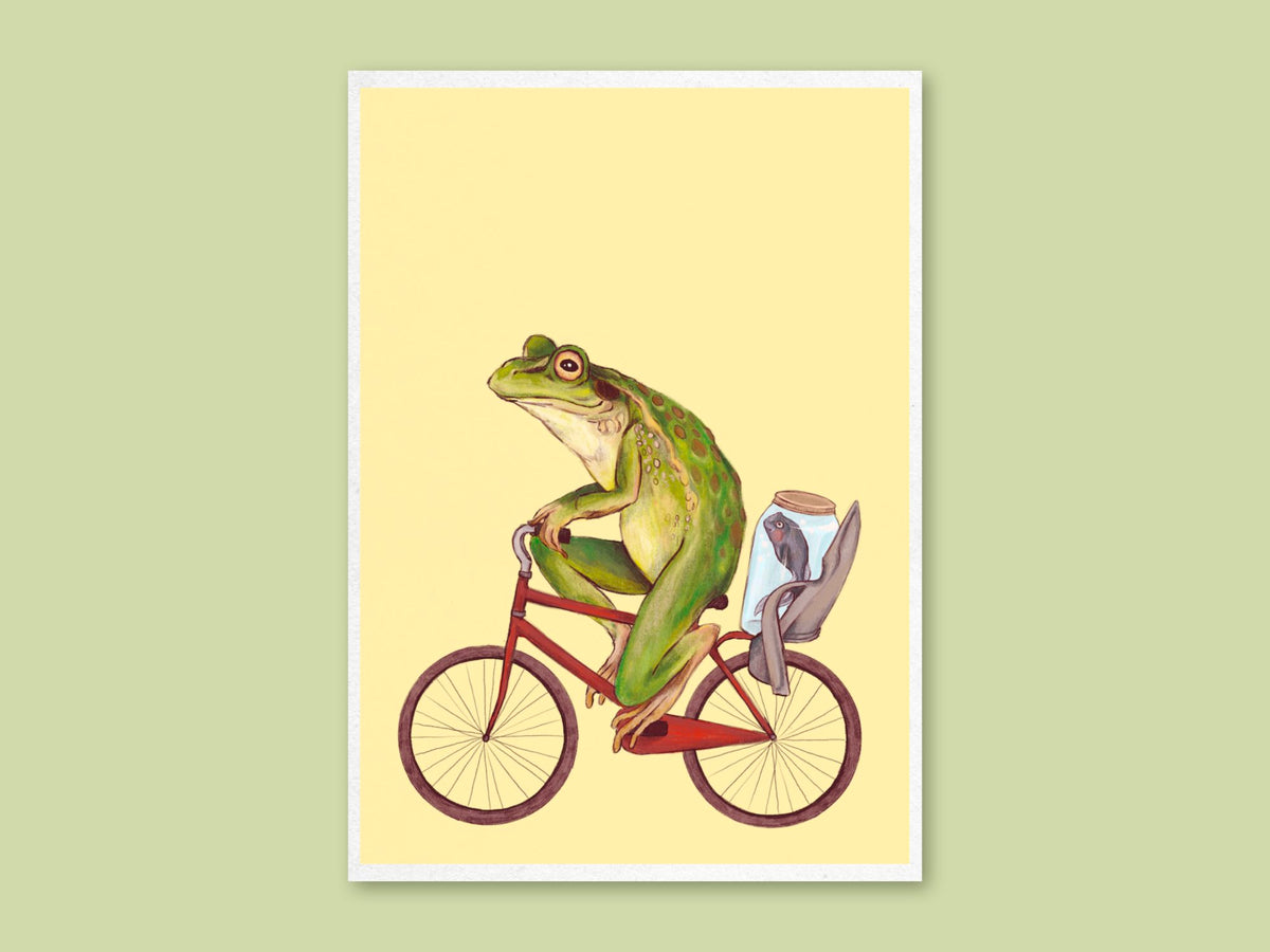 Bicycle Frog art print by Anna Seed: a green frog riding a red bicycle with a fish in a jar, on pale yellow