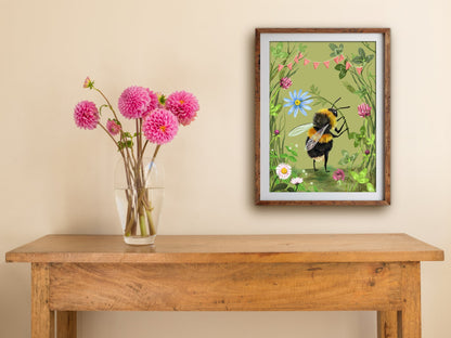 Bumblebee print of a bee among clover and daisies, framed on a cream wall above a wooden table with pink dahlias