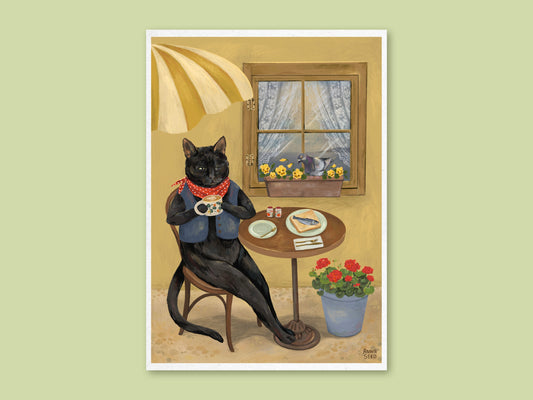 Cat Café art print by Anna Seed: a black cat in a red neckerchief sips coffee at a little café table beneath a striped umbrella