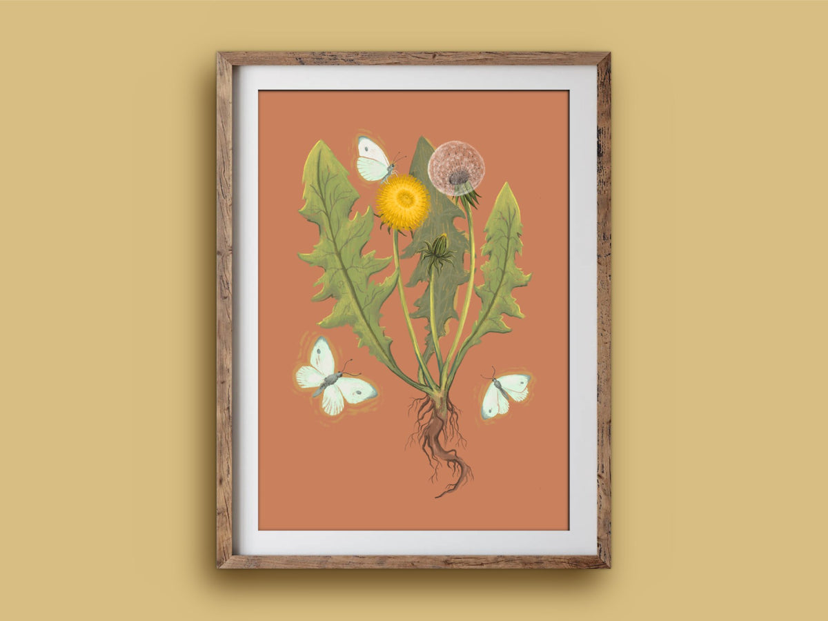 Dandelion print in a rustic wooden frame on a mustard wall, showing a botanical dandelion with fluttering white moths