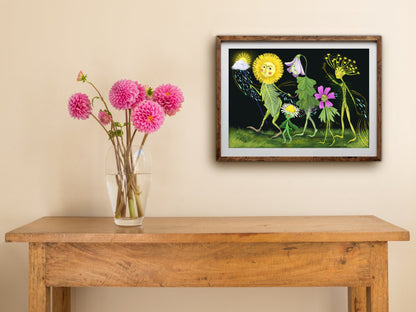 Framed Flower Parade print of spring flower characters walking in procession, hung above a wooden side table with dahlias