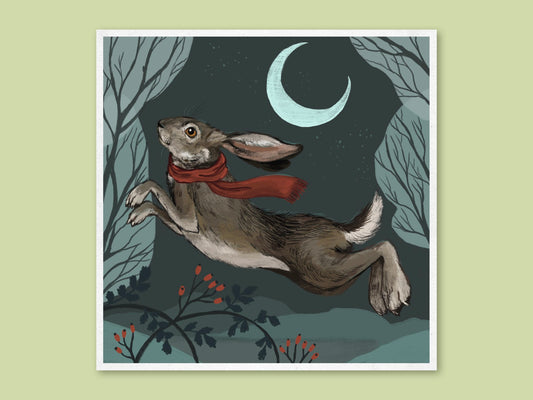 Hare in Winter art print by Anna Seed: a hare in a red scarf leaps beneath a crescent moon through a frosty night wood