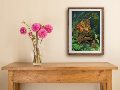 Framed How to Grow print on a cream wall above a wooden side table with a glass vase of pink dahlias