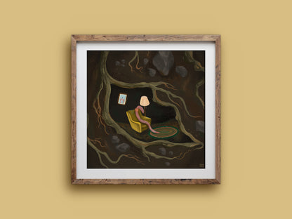 If I Were A Worm print in a timber frame: a pink worm in a cosy armchair with a rug and lamp, nestled among dark roots