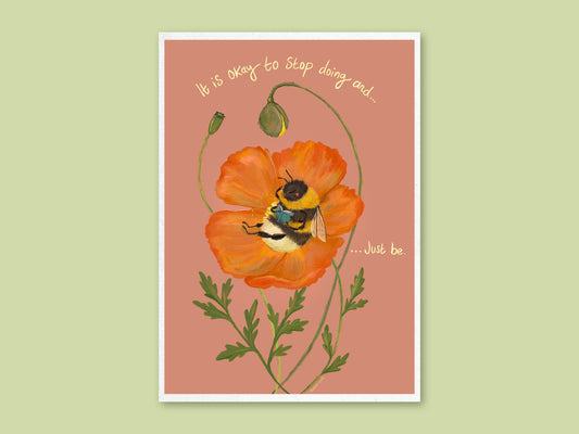 Just Bee art print by Anna Seed: a bumblebee reads a book in an orange poppy, lettered "It is okay to stop doing and... just be"
