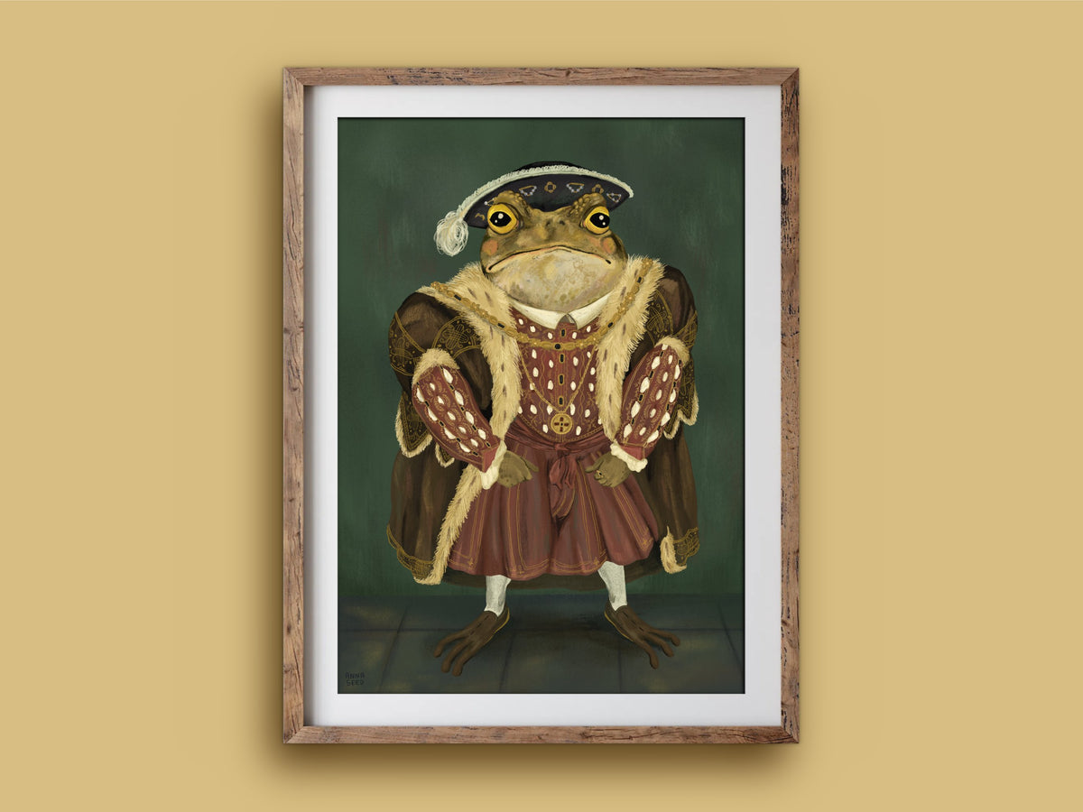 King Toad print in a timber frame: a regal toad in a plumed hat and red Tudor doublet, painted as a portrait on green