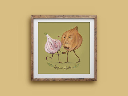 Square Perfect Together print in a wooden frame on a mustard wall, a garlic and onion couple dancing with a little heart