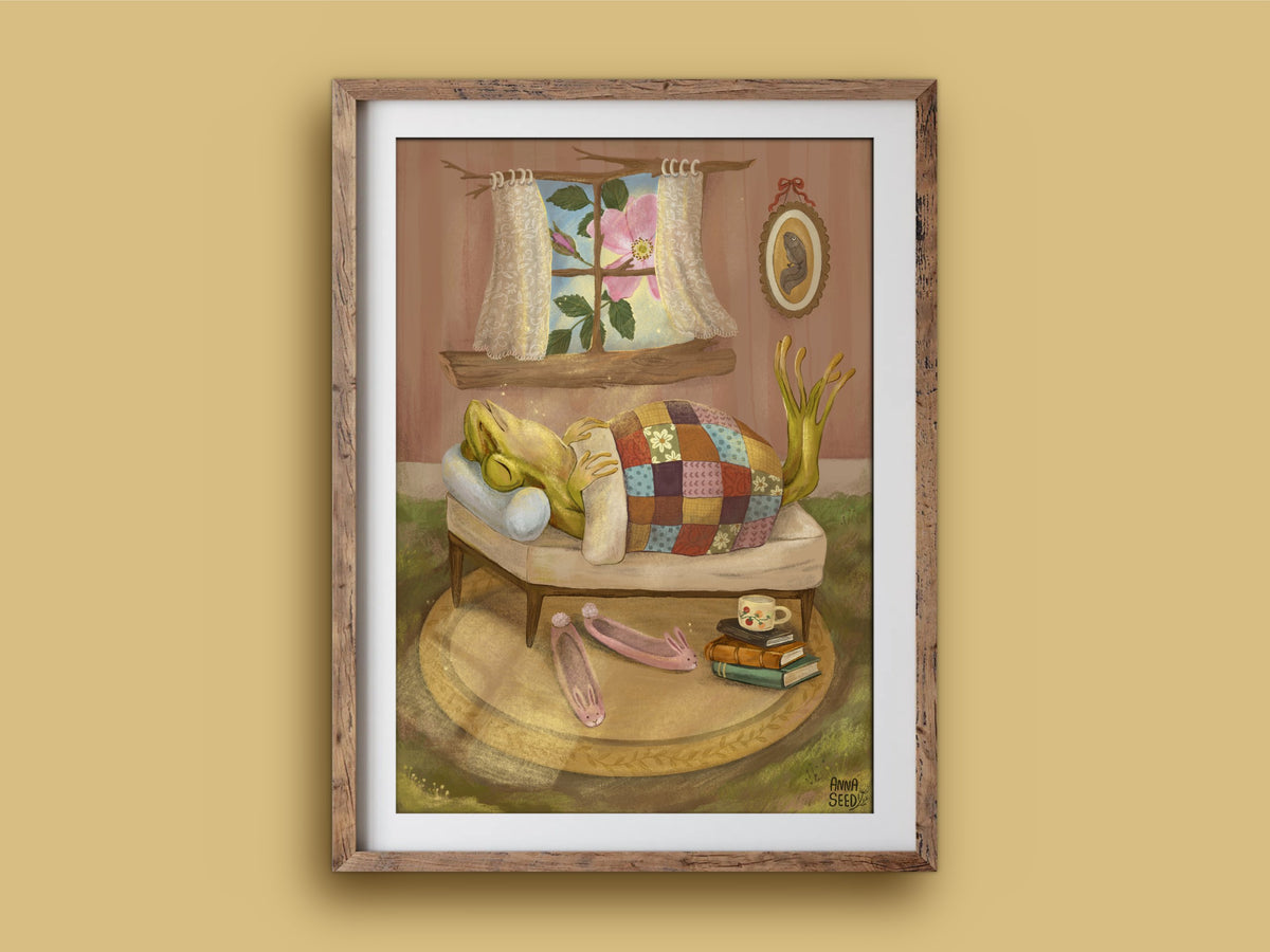 Sleeping In print in a wooden frame on a mustard wall, a sleepy frog in bed with pink slippers and books on the rug