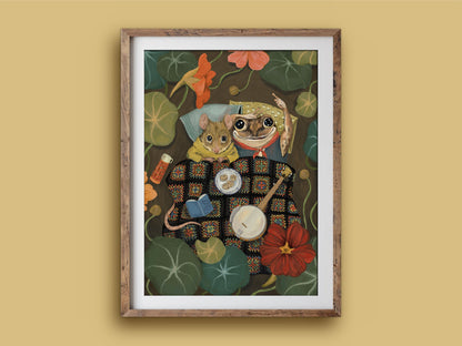 Starry Eyes print in a wooden frame on a mustard wall, mouse and frog campers with a banjo, book and biscuits