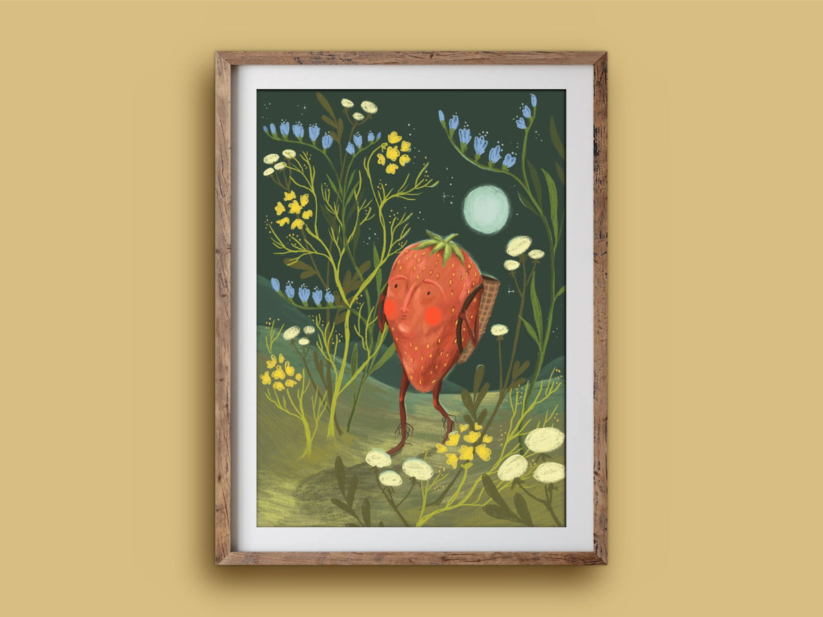 Strawberry Adventurer print in a wooden frame on a mustard wall, a rosy strawberry hiking under a pale moon