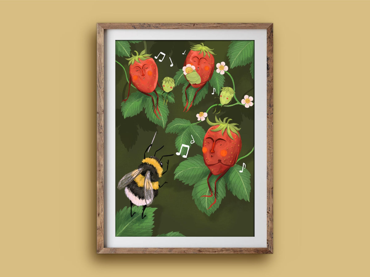 Strawberry Choir print in a wooden frame on a mustard wall, rosy strawberries singing to a bee's baton with music notes
