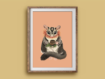 Sugar Glider Teatime print in a wooden frame on a mustard wall, a wide-eyed sugar glider with its gumnut teacup