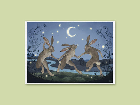Velveteen Dancers art print by Anna Seed, three hares dancing hand in hand beside a winding river under a crescent moon