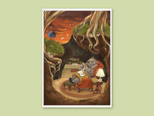 Wombat Burrow art print by Anna Seed, a wombat reading in a red armchair by lamplight in a root-lined burrow at sunset